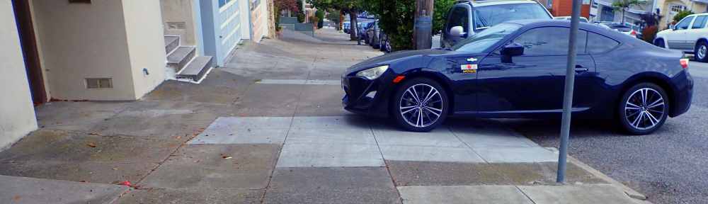 Car Partially Blocking Sidewalk