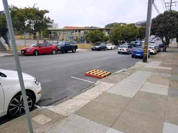 Pallet used to block save a public parking space