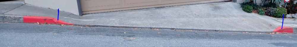 red painted curbcut to a driveway